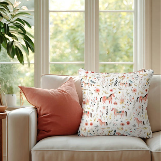 Beige sofa with decorative floral horse design pillows in a bright living room
