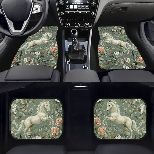 Car interior with floral and horse-patterned floor mats and coasters.