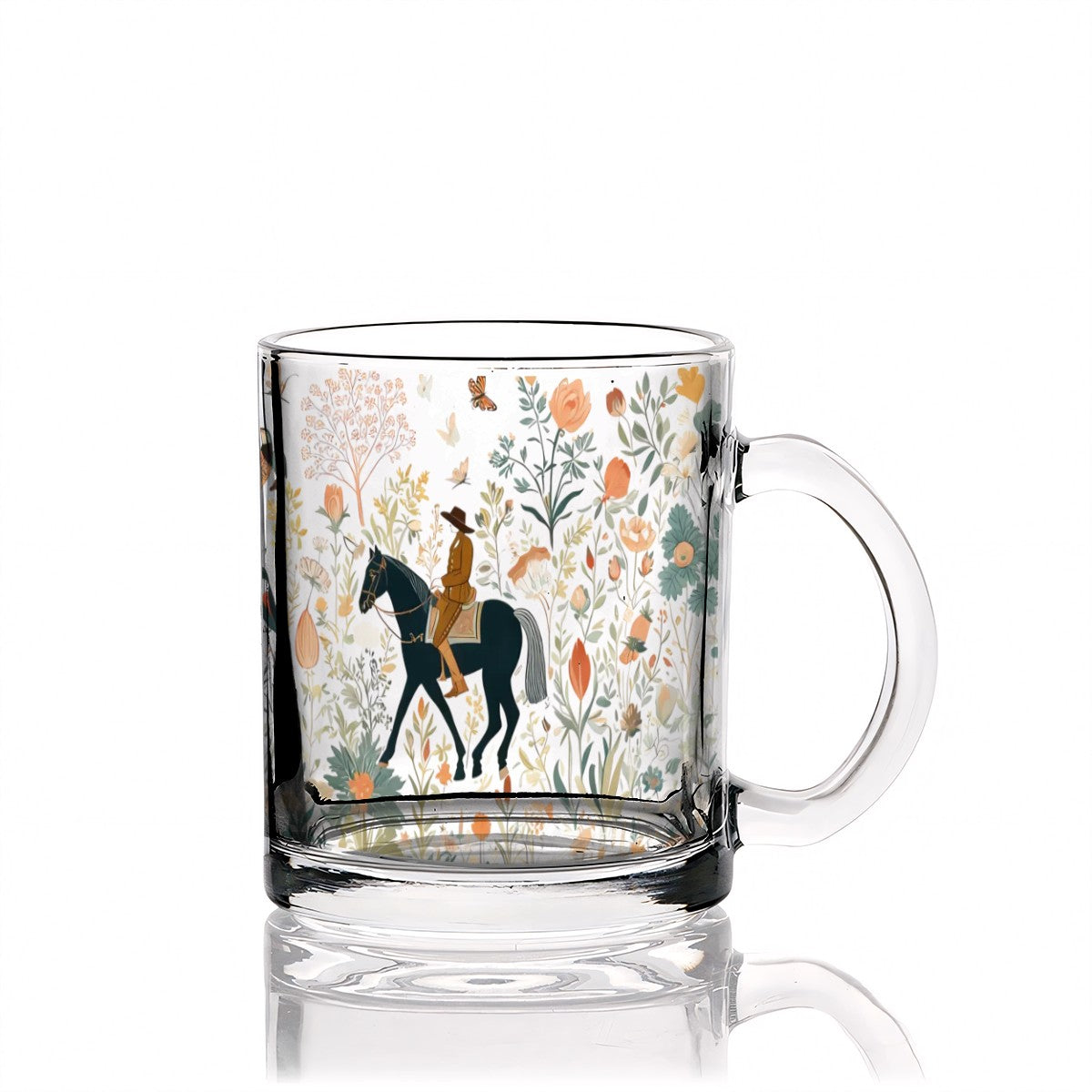 Clear glass mug with a horse and rider design on a white background
