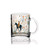 Clear glass mug with a horse and rider design on a white background