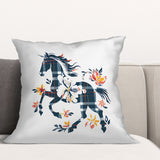 Decorative pillow with a horse and floral design on a white background