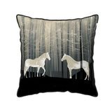 Decorative pillow with horses in a forest design on a black background