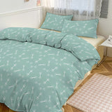 Teal bedding set with bone pattern on a bed in a bedroom.