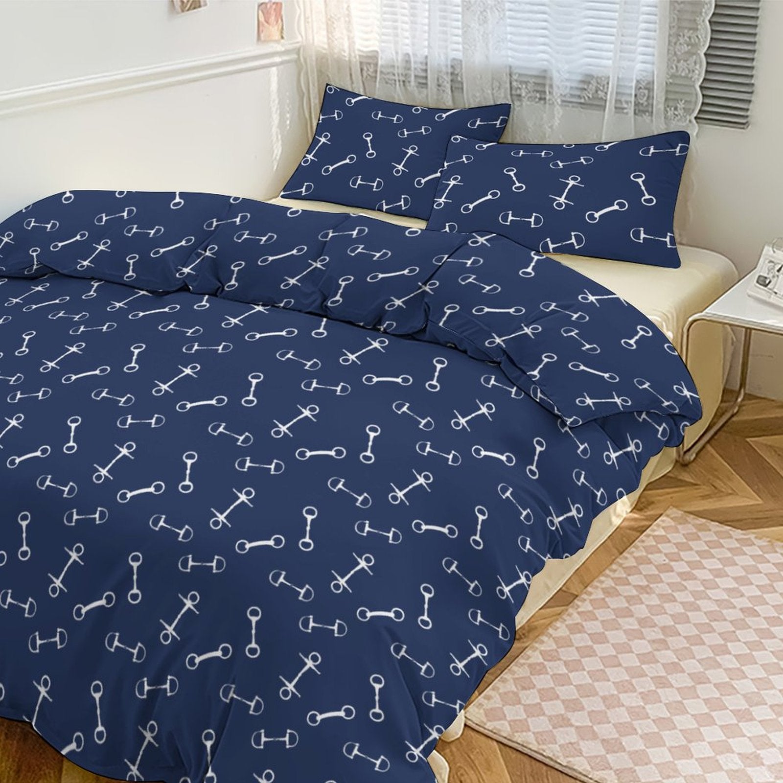 Navy blue bedding set with white bone pattern on a bed in a bedroom.