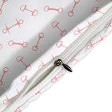 Close-up of a white zipper on a fabric with red patterns