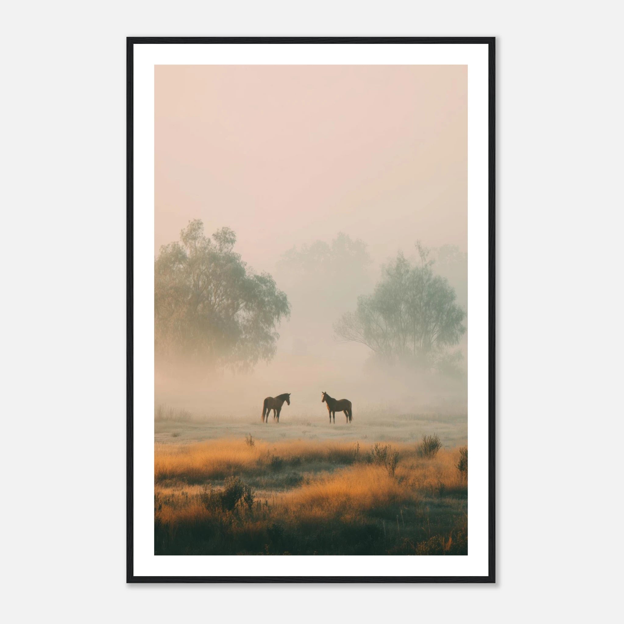 Two horses standing in a misty field with warm golden light and soft atmospheric haze.